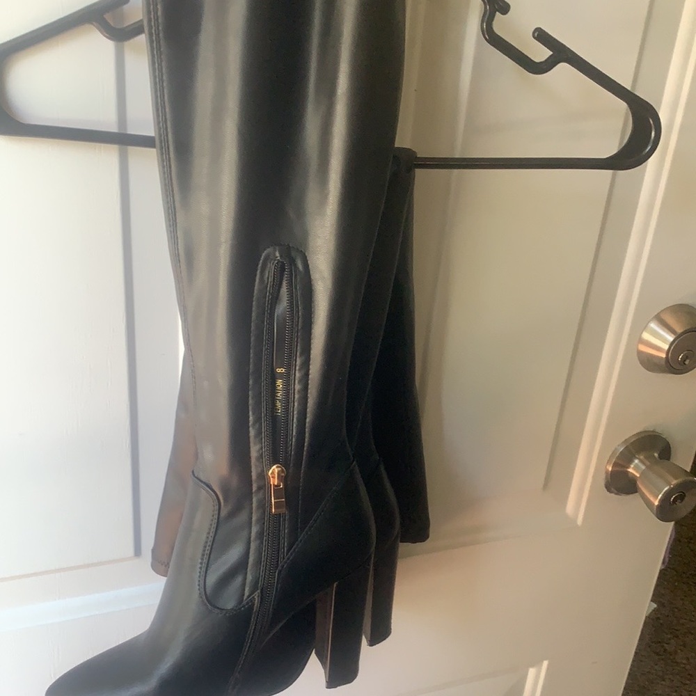 Thigh high black boots